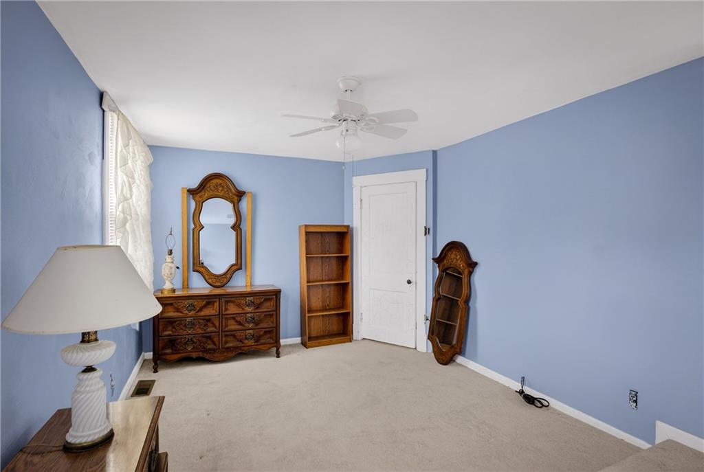 417 Zara Street Pittsburgh, PA 15210 - Photo 41 of 47 a bedroom with a bed and dresser