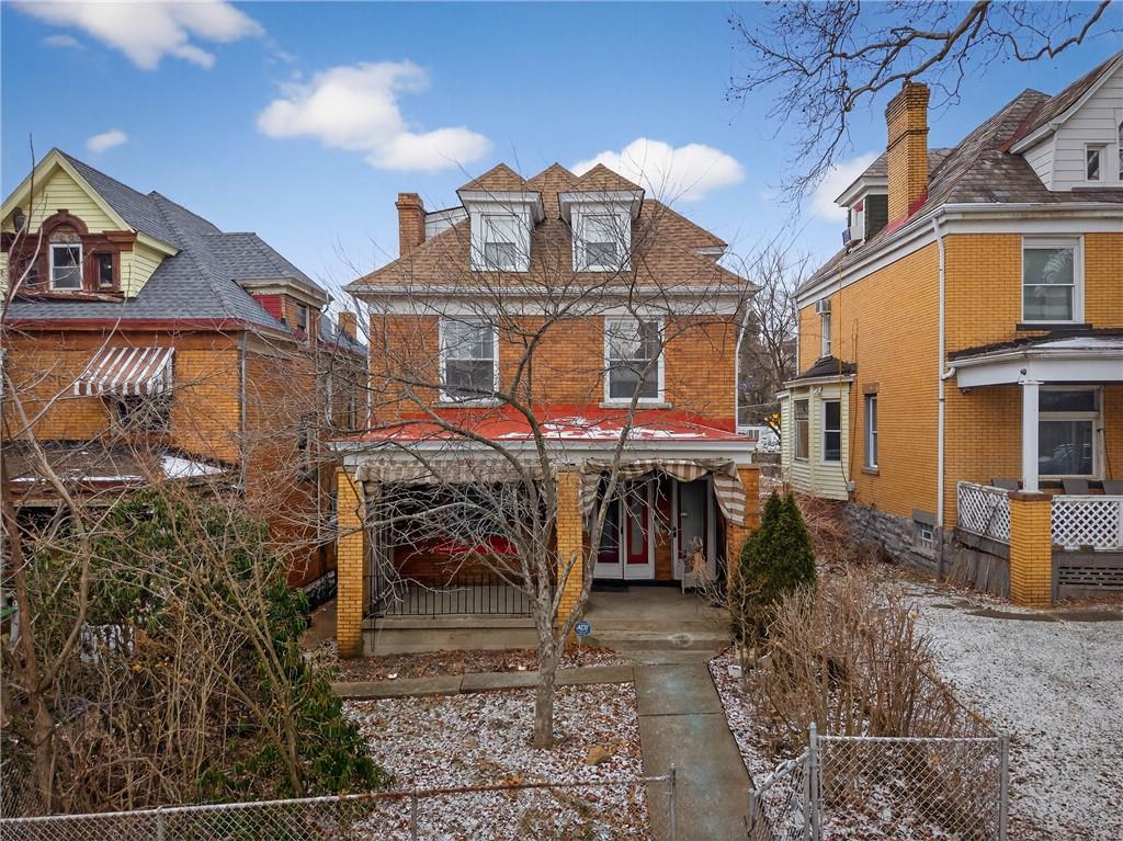 417 Zara Street Pittsburgh, PA 15210 - Photo 5 of 47 a view of a house with a patio