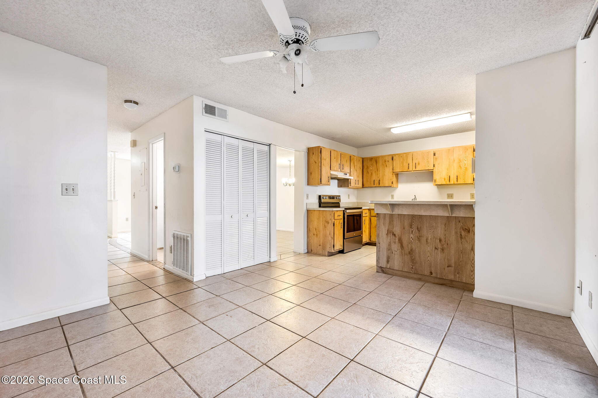 2016 Manor Drive Northeast Palm Bay, FL 32905 - Photo 12 of 29 a view of kitchen with stainless steel appliances cabinets and window