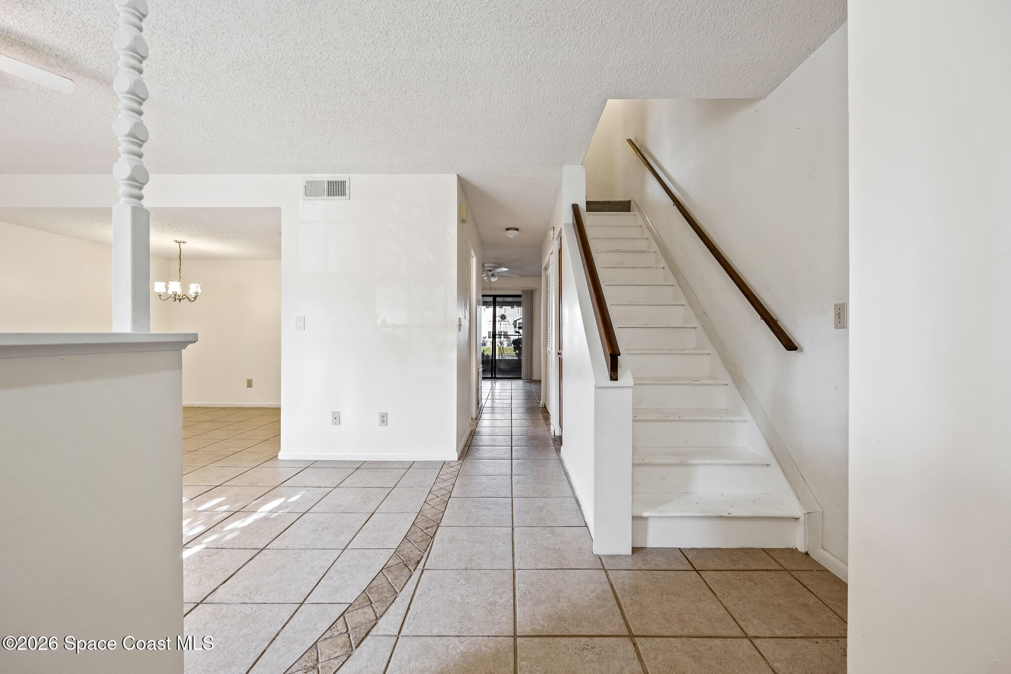 2016 Manor Drive Northeast Palm Bay, FL 32905 - Photo 18 of 29 a view of entryway with stairs