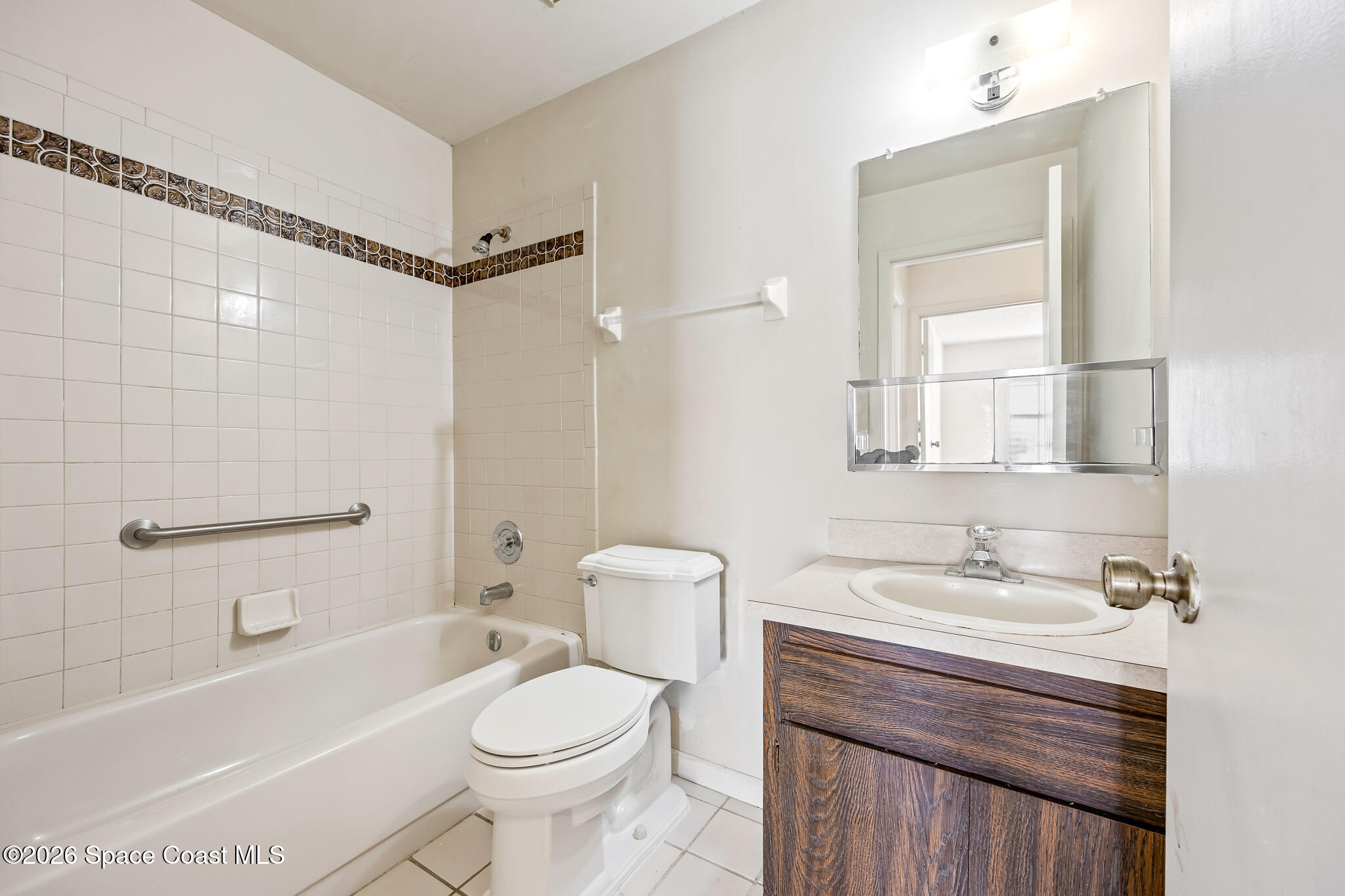 2016 Manor Drive Northeast Palm Bay, FL 32905 - Photo 20 of 29 a bathroom with a sink a toilet and shower