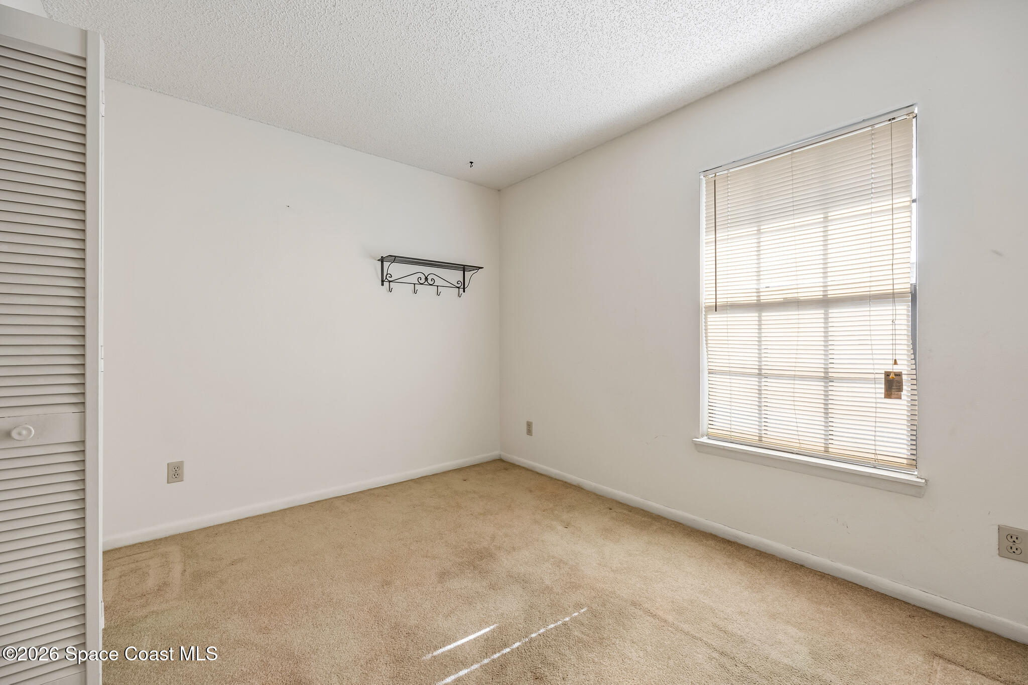 2016 Manor Drive Northeast Palm Bay, FL 32905 - Photo 22 of 29 an empty room with a window