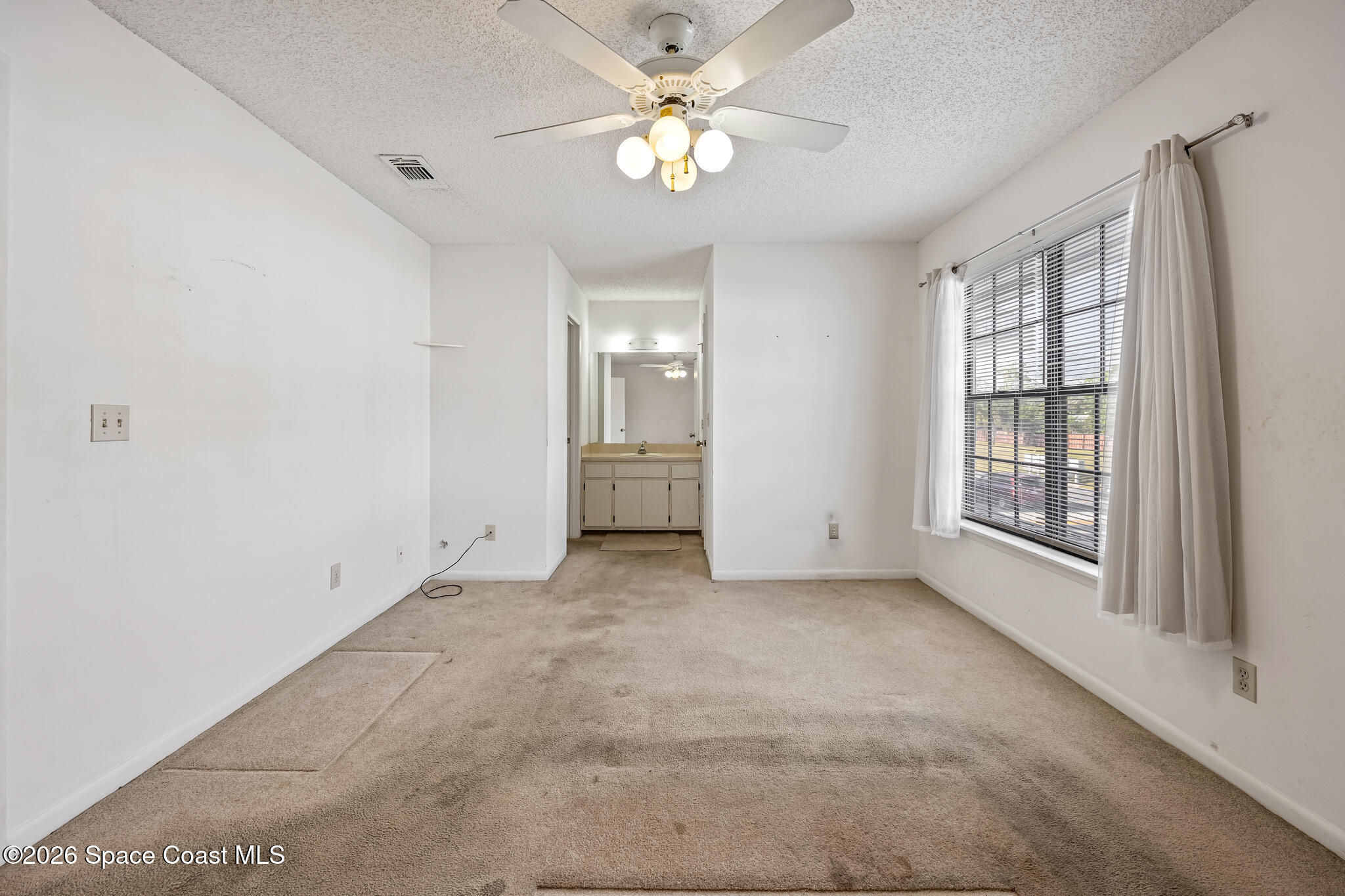 2016 Manor Drive Northeast Palm Bay, FL 32905 - Photo 27 of 29 a view of an empty room with a window