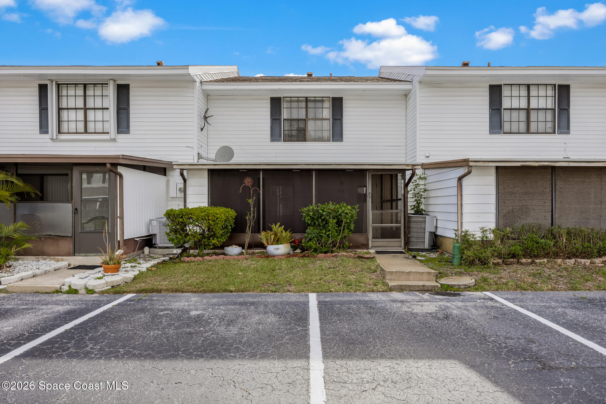 2016 Manor Drive Northeast Palm Bay, FL 32905 - Photo 3 of 29 a front view of a house with garden