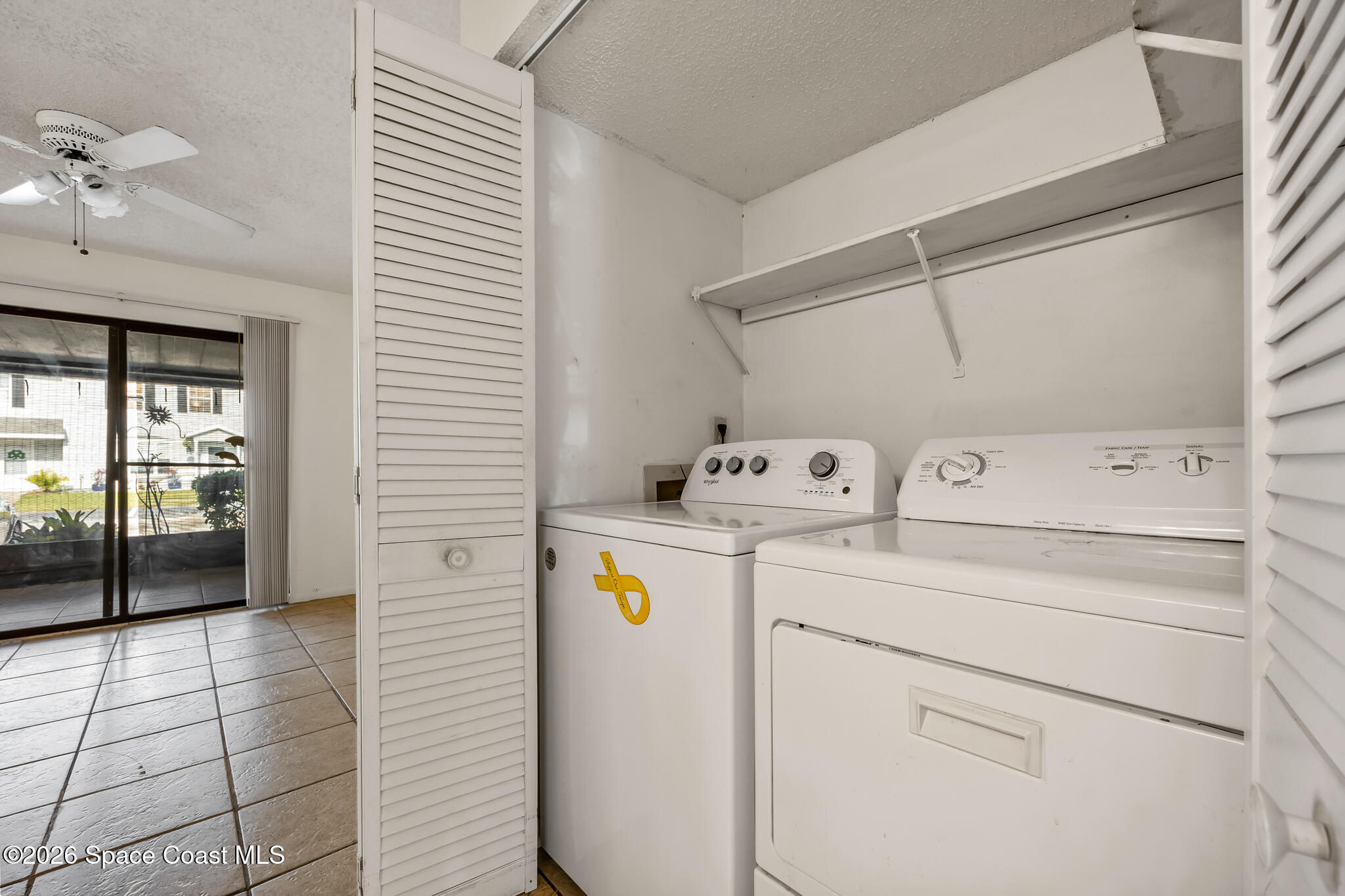 2016 Manor Drive Northeast Palm Bay, FL 32905 - Photo 9 of 29 a utility room with dryer and washer