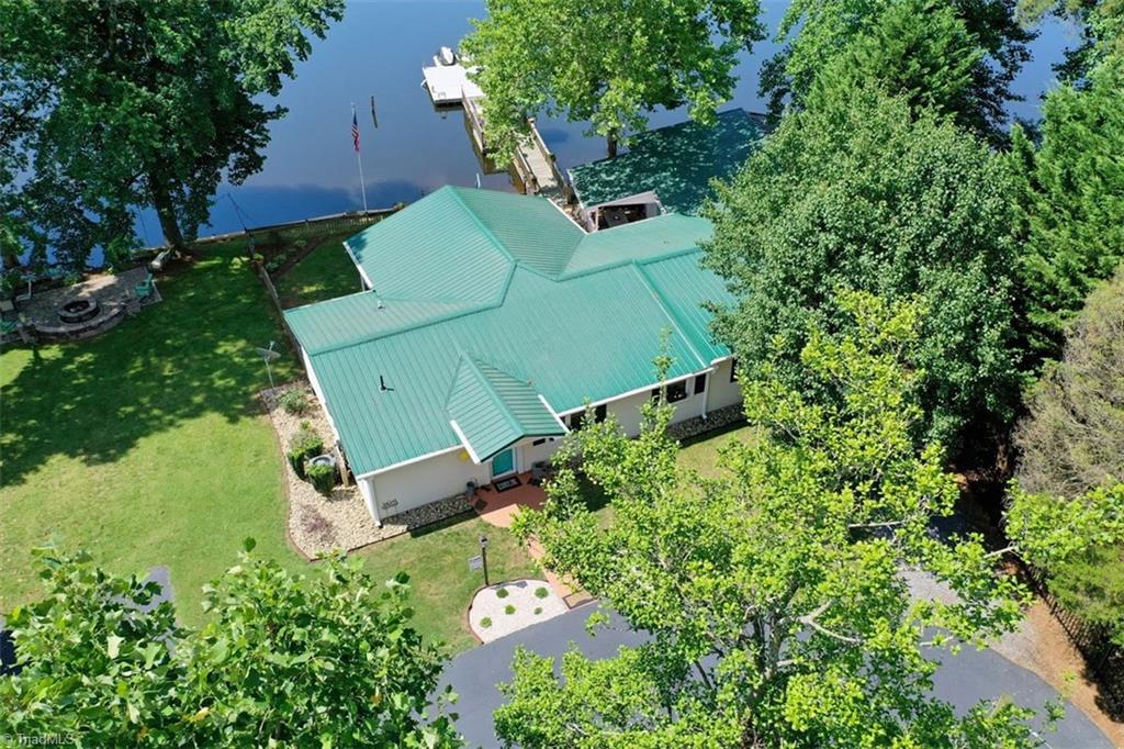 780 Cedar Branch Road Denton, NC 27239 - Photo 12 of 29 Metal roof on home and boat house. Beautiful flat double lot. Great entertaining areas outside!