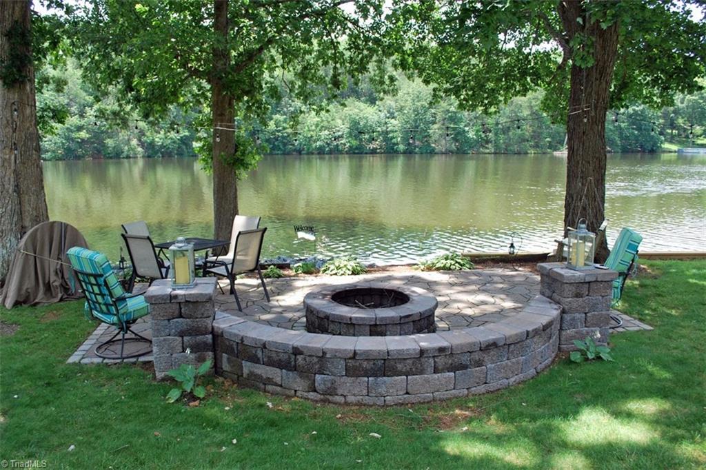 780 Cedar Branch Road Denton, NC 27239 - Photo 20 of 29 You can't get much closer to the water than this! Gorgeous seating area with fire pit, built new in 2019.