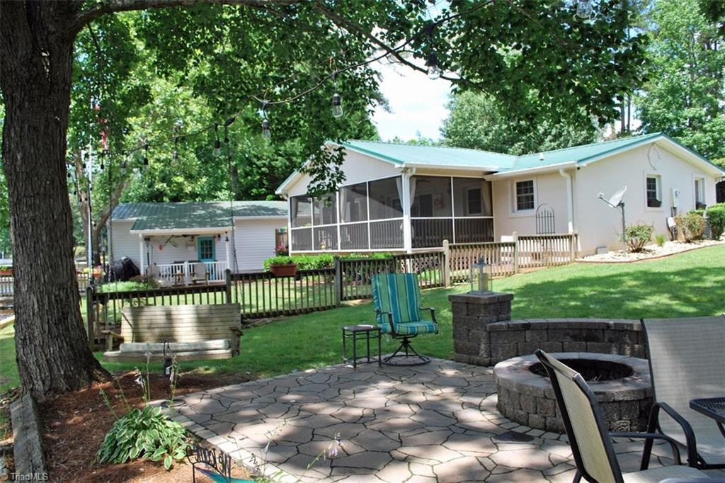 780 Cedar Branch Road Denton, NC 27239 - Photo 21 of 29 Gorgeous flat double lot. Fenced in back yard for pets. New firepit area.