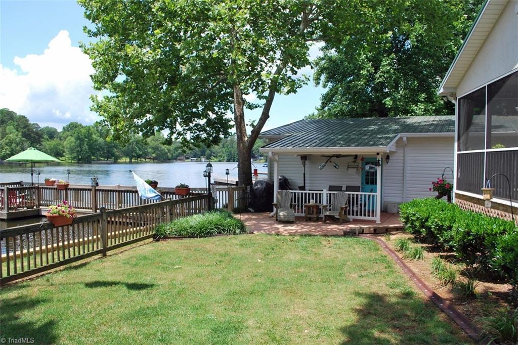 780 Cedar Branch Road Denton, NC 27239 - Photo 22 of 29 Fenced in back yard. Private pier and floater. New seawall and rip rap in 2019. Great swimming area! 12 feet of water depth at the end of the pier!