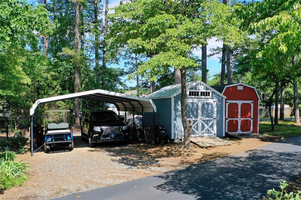 780 Cedar Branch Road Denton, NC 27239 - Photo 25 of 29 Circular driveway has had recent blacktopping. Also includes 2 storage buildings and a carport.