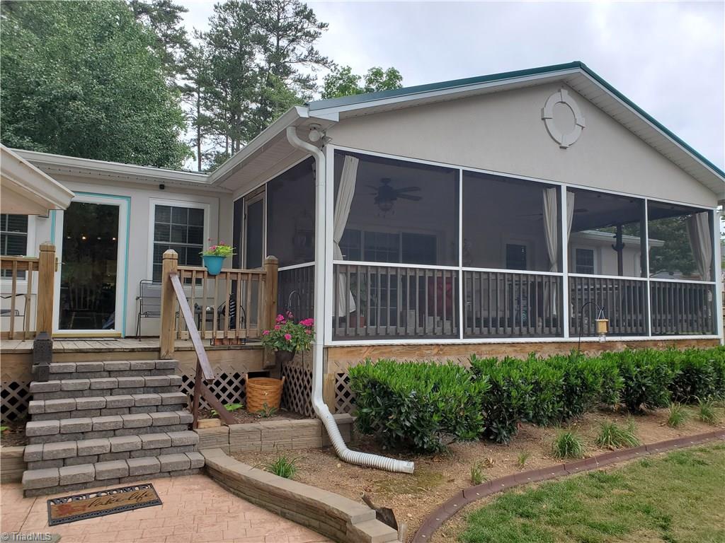 780 Cedar Branch Road Denton, NC 27239 - Photo 28 of 29 Gorgeous screened porch with ceiling fans. Outlets for TV and cable already installed. Gorgeous landscaping. French drains and new gutters also.