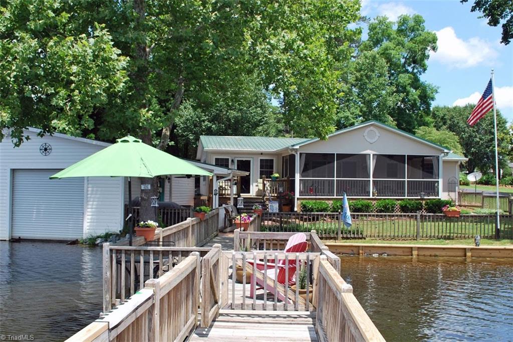 780 Cedar Branch Road Denton, NC 27239 - Photo 7 of 29 New seawall and rip rap in 2019. Look at that gorgeous screened porch!