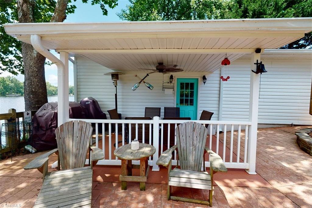 780 Cedar Branch Road Denton, NC 27239 - Photo 9 of 29 Boathouse with covered patio area. This home has wonderful outside entertaining areas. Boathouse has winch and rails.