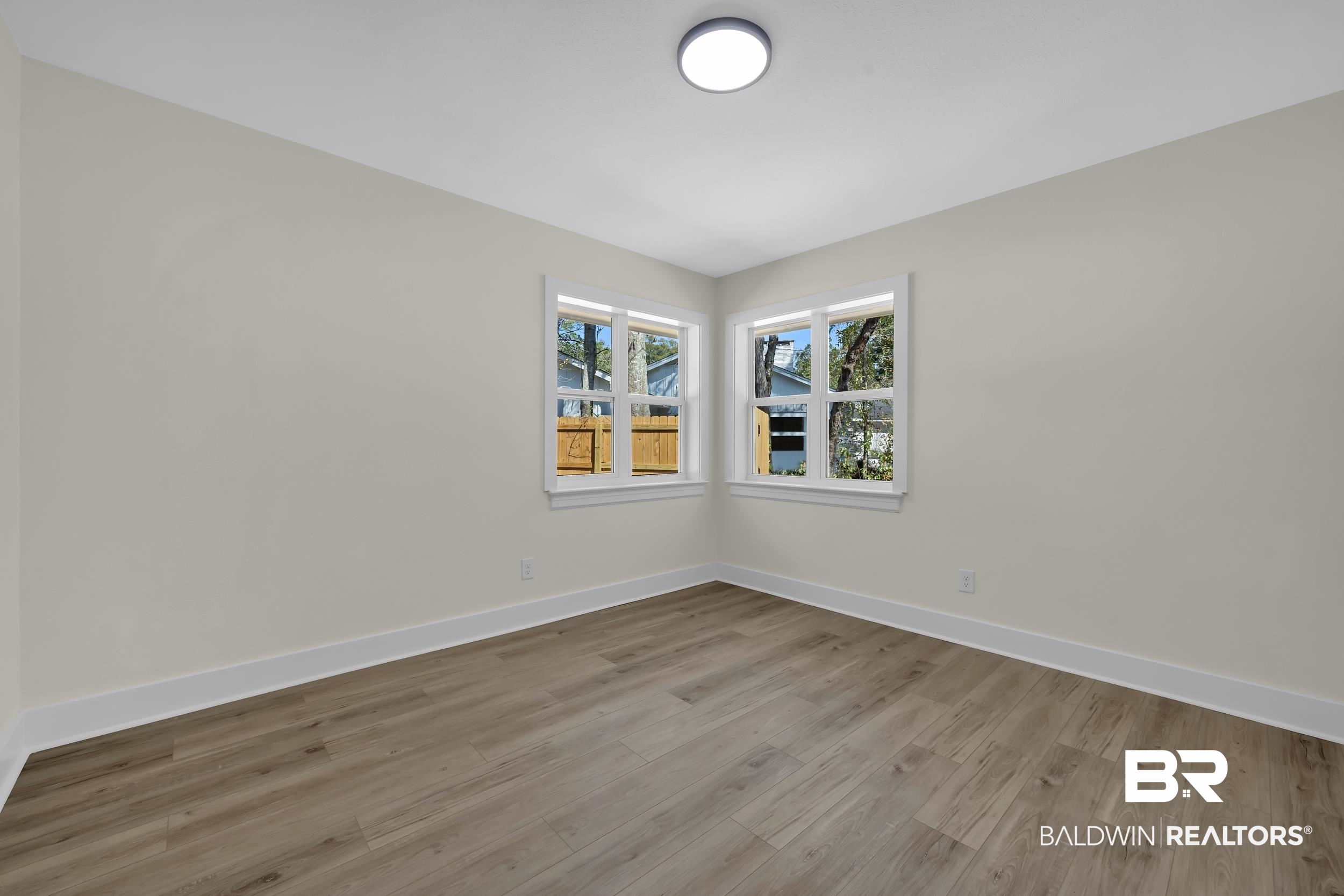 1409 Altair Lane Mobile, AL 36693 - Photo 13 of 23 Empty room featuring baseboards and light wood-type flooring