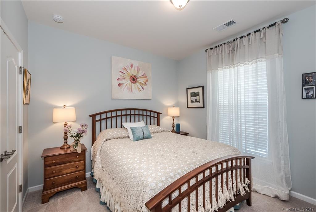 4285 Perth Road Indian Land, SC 29707 - Photo 12 of 24 a bedroom with a bed a painting on the wall and a window