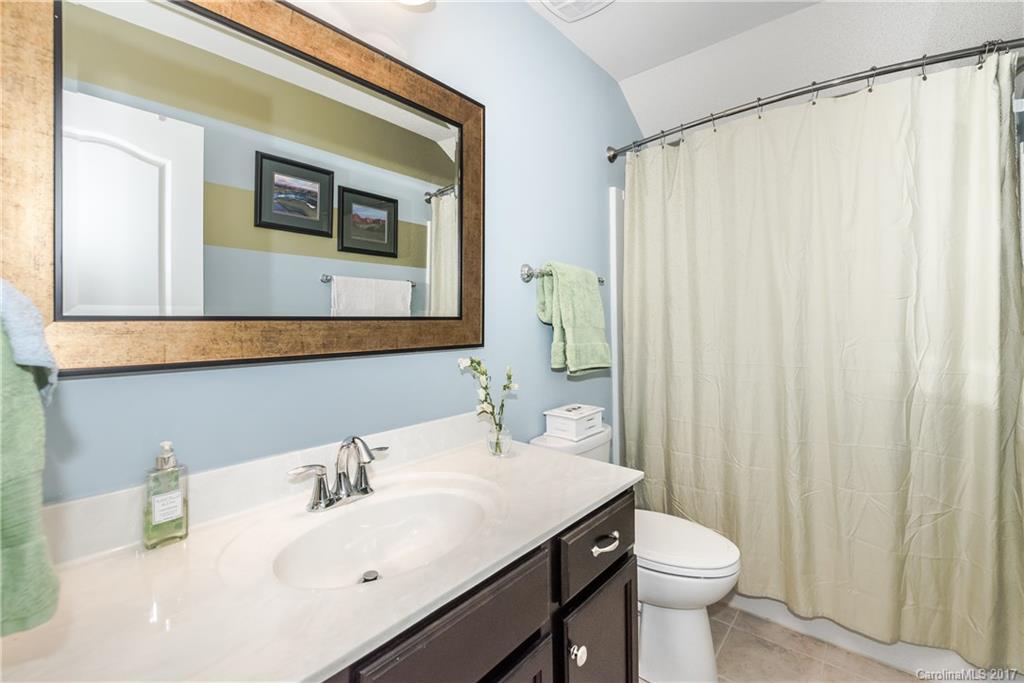 4285 Perth Road Indian Land, SC 29707 - Photo 16 of 24 a bathroom with a sink a toilet and shower curtain