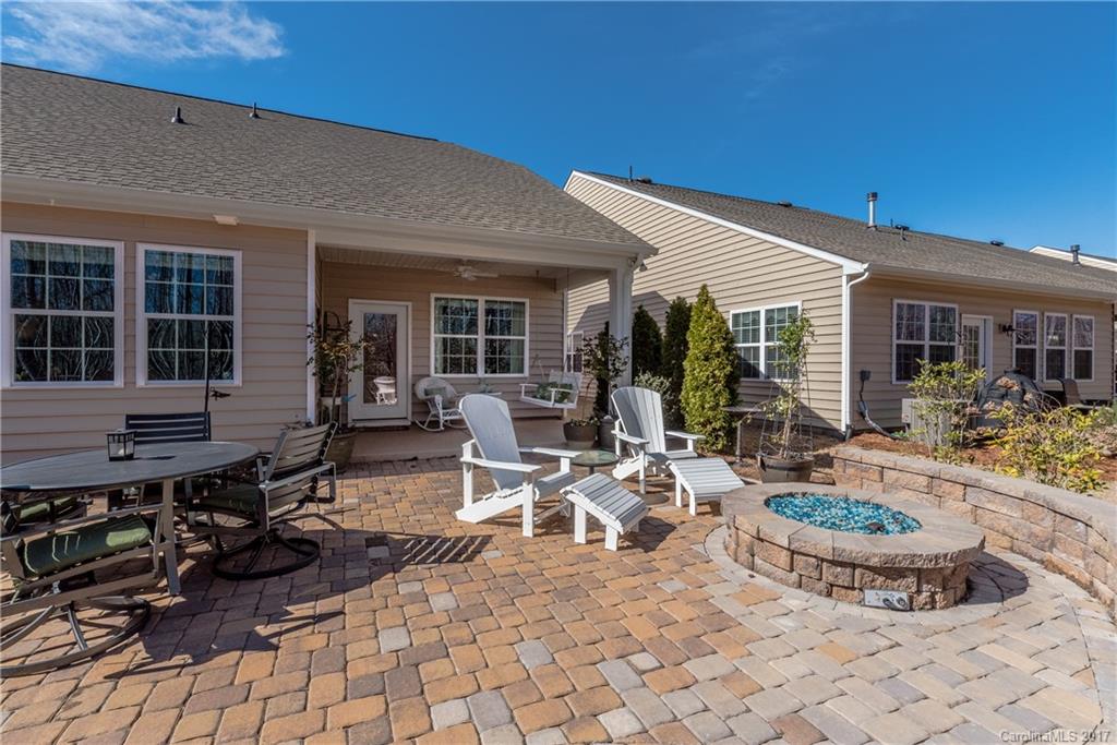 4285 Perth Road Indian Land, SC 29707 - Photo 19 of 24 a view of a patio with table and chairs and potted plants