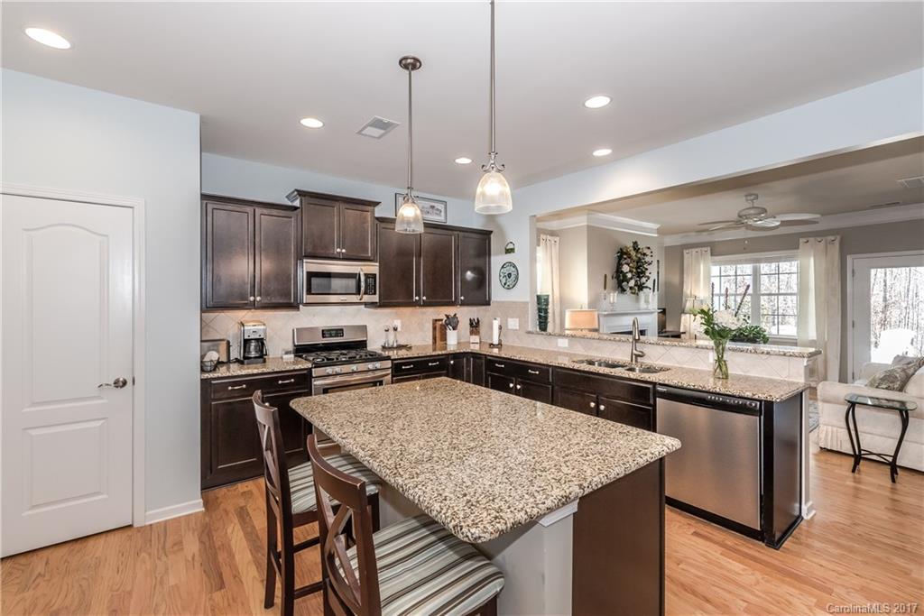 4285 Perth Road Indian Land, SC 29707 - Photo 5 of 24 a kitchen with a kitchen island and stainless steel appliances