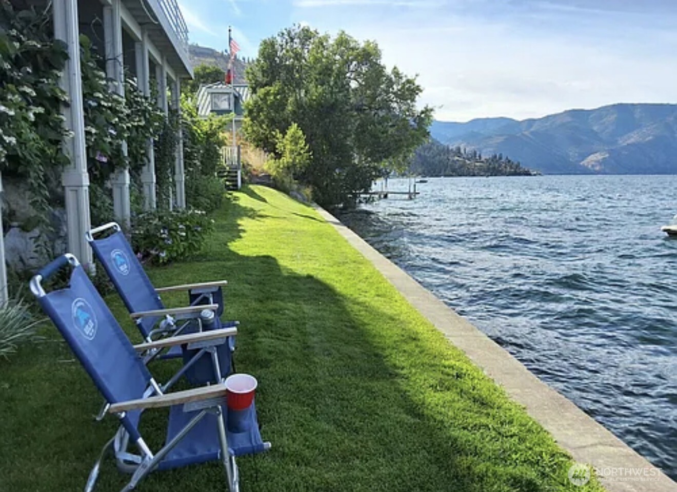 2685 South Lakeshore Road Chelan, WA 98816 - Photo 13 of 16 a view of a chairs and table in backyard