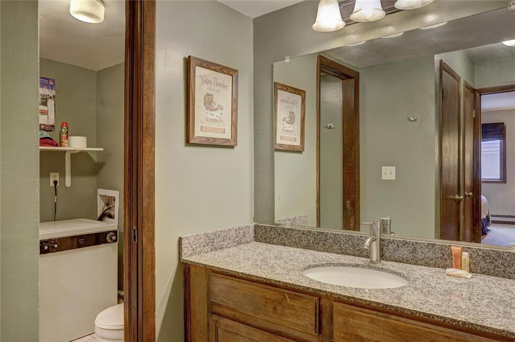 325 Four Oclock Road, Unit C203 Breckenridge, CO 80424 - Photo 24 of 35 a bathroom with a granite countertop sink toilet and shower