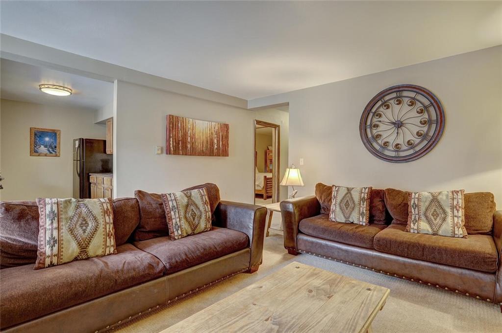 325 Four Oclock Road, Unit C203 Breckenridge, CO 80424 - Photo 5 of 35 a living room with furniture and a couch