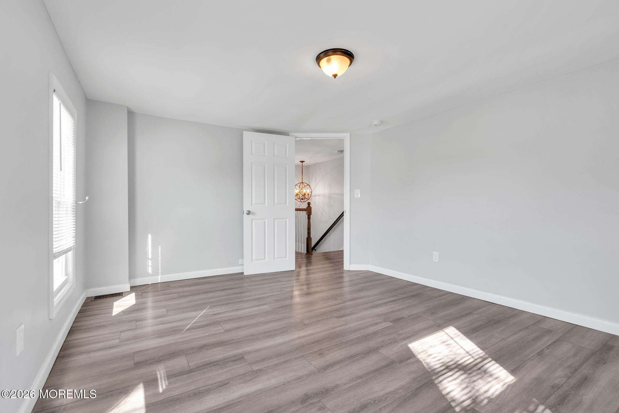 367 South Green Street Tuckerton, NJ 08087 - Photo 19 of 41 a view of an empty room with wooden floor and window