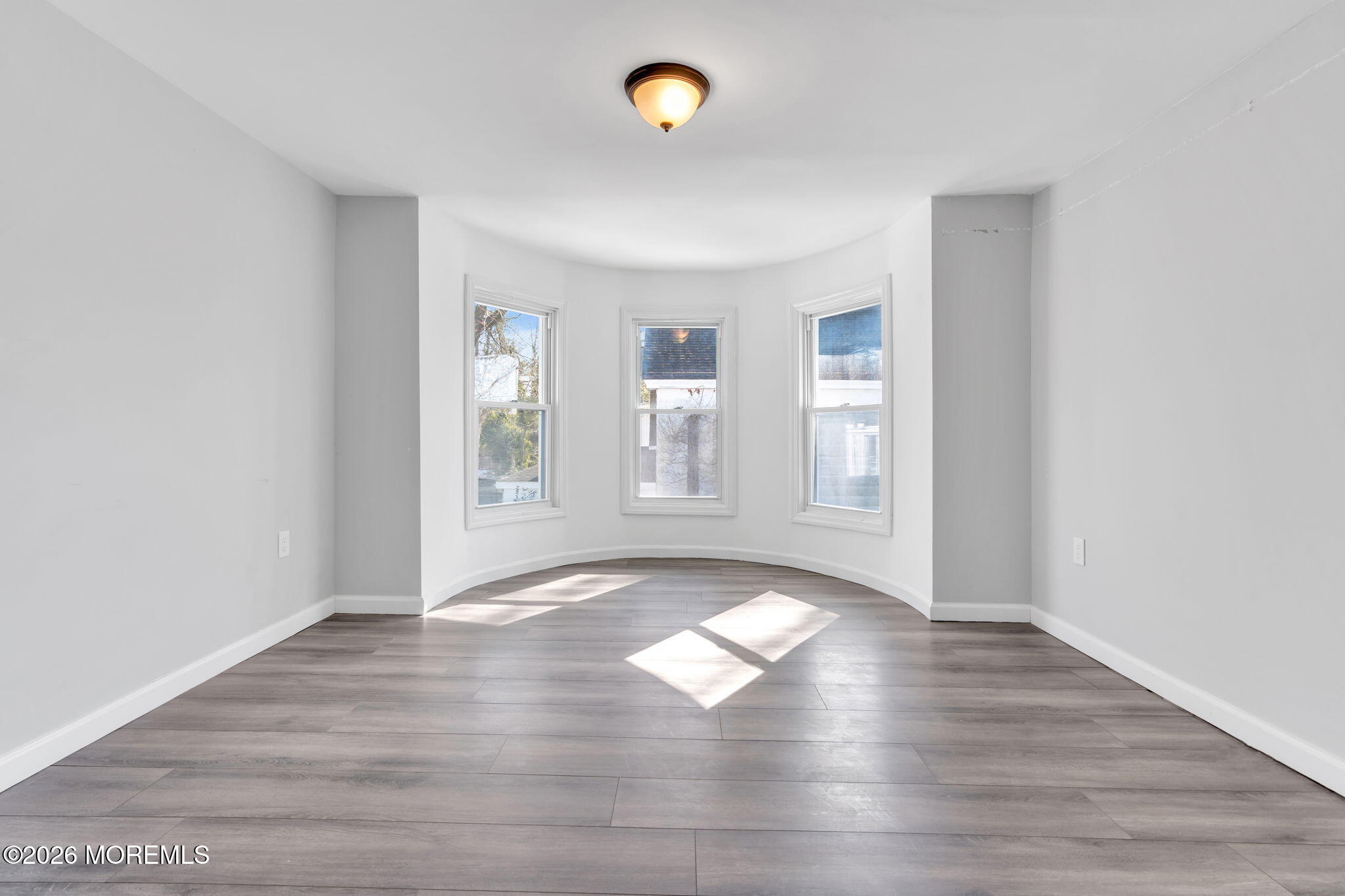 367 South Green Street Tuckerton, NJ 08087 - Photo 21 of 41 an empty room with wooden floor and windows