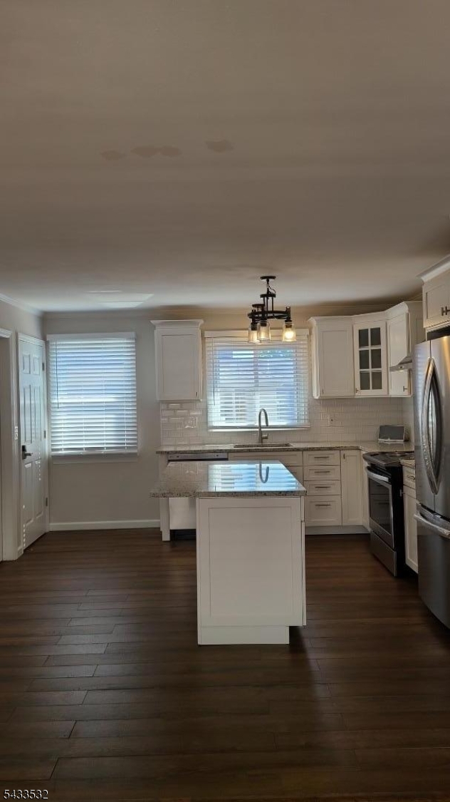 16 Ocean Street Millburn, NJ 07041 - Photo 7 of 26 a kitchen with a sink cabinets and wooden floor