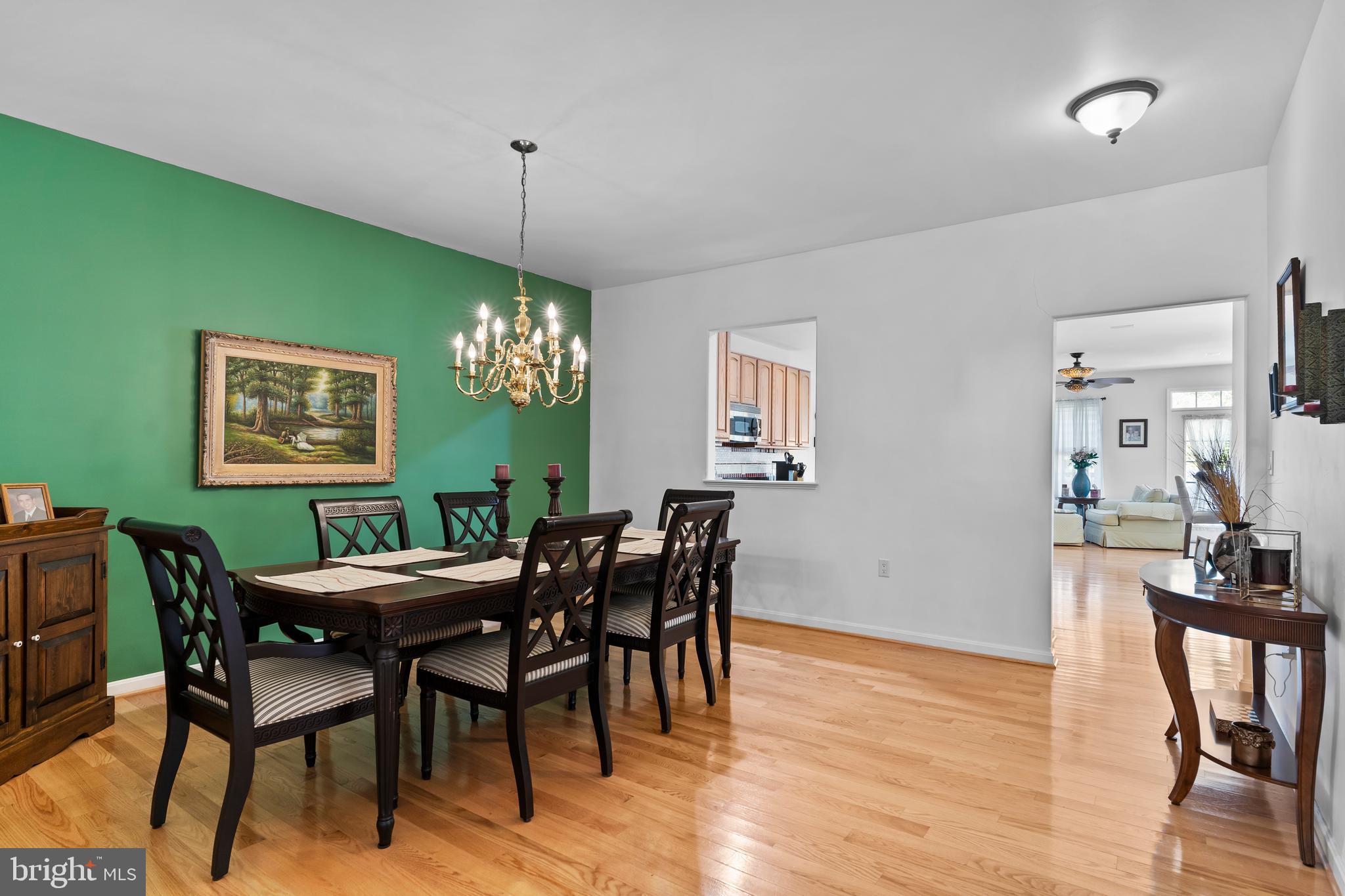 152 St Michaels Way Hanover, PA 17331 - Photo 12 of 37 a view of a dining room with furniture window and wooden floor