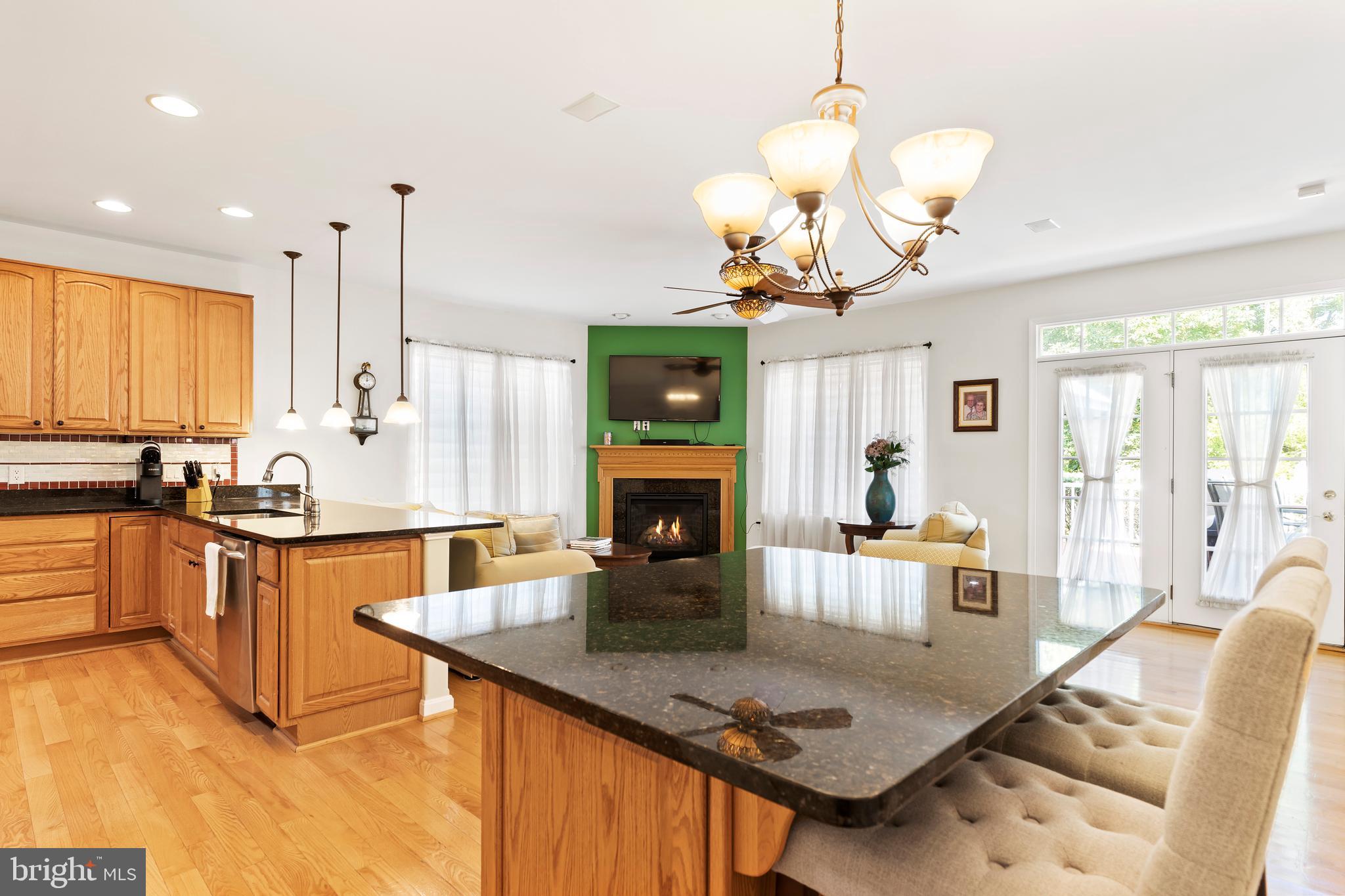 152 St Michaels Way Hanover, PA 17331 - Photo 18 of 37 a kitchen with sink refrigerator dining table and chairs