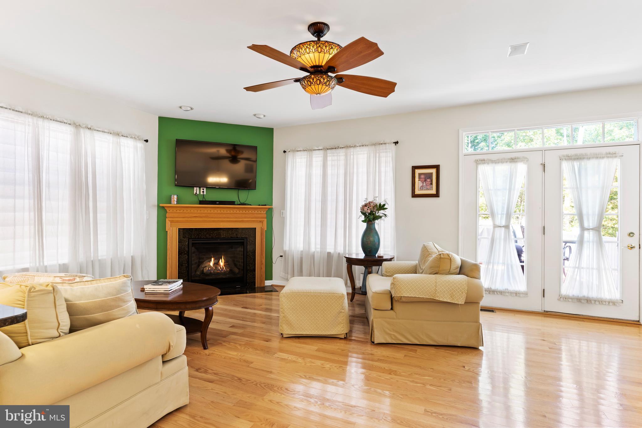 152 St Michaels Way Hanover, PA 17331 - Photo 20 of 37 a living room with furniture fireplace and flat screen tv