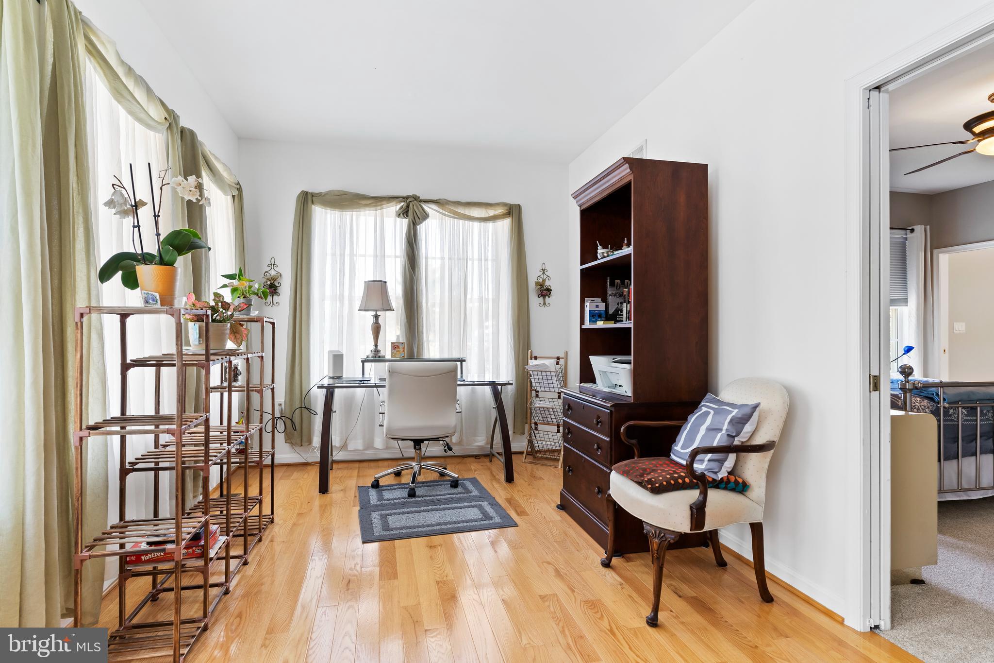 152 St Michaels Way Hanover, PA 17331 - Photo 21 of 37 a living room with furniture a rug and a floor to ceiling window