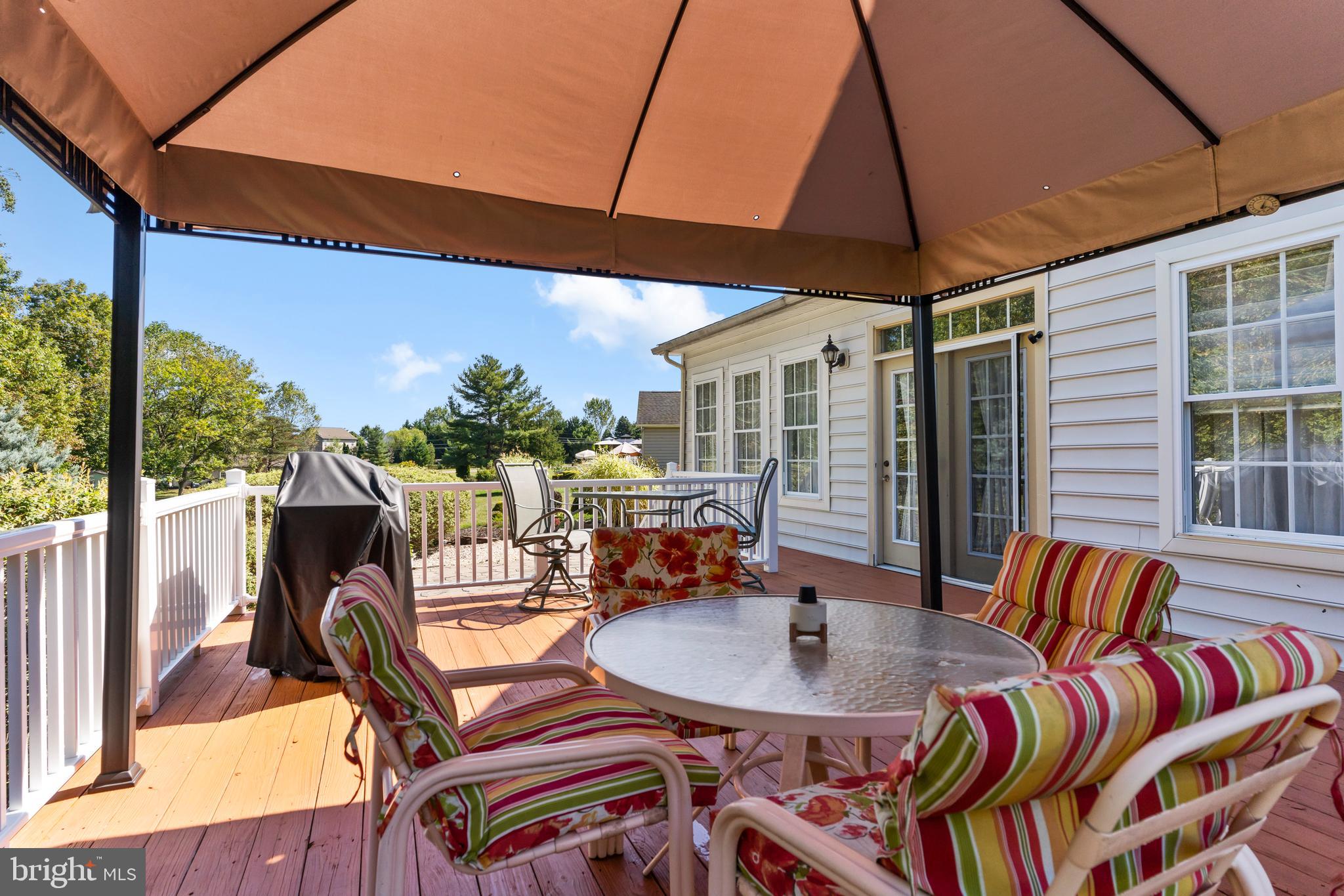 152 St Michaels Way Hanover, PA 17331 - Photo 32 of 37 a balcony view with a dining table and chairs with wooden floor