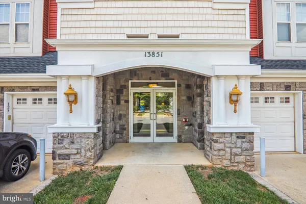 a front view of a building with outdoor seating