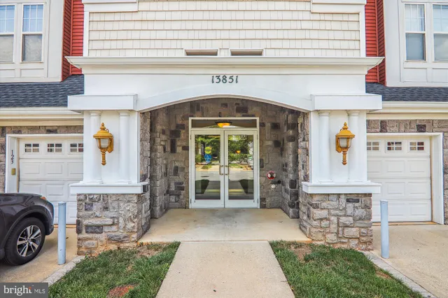 a front view of a building with outdoor seating