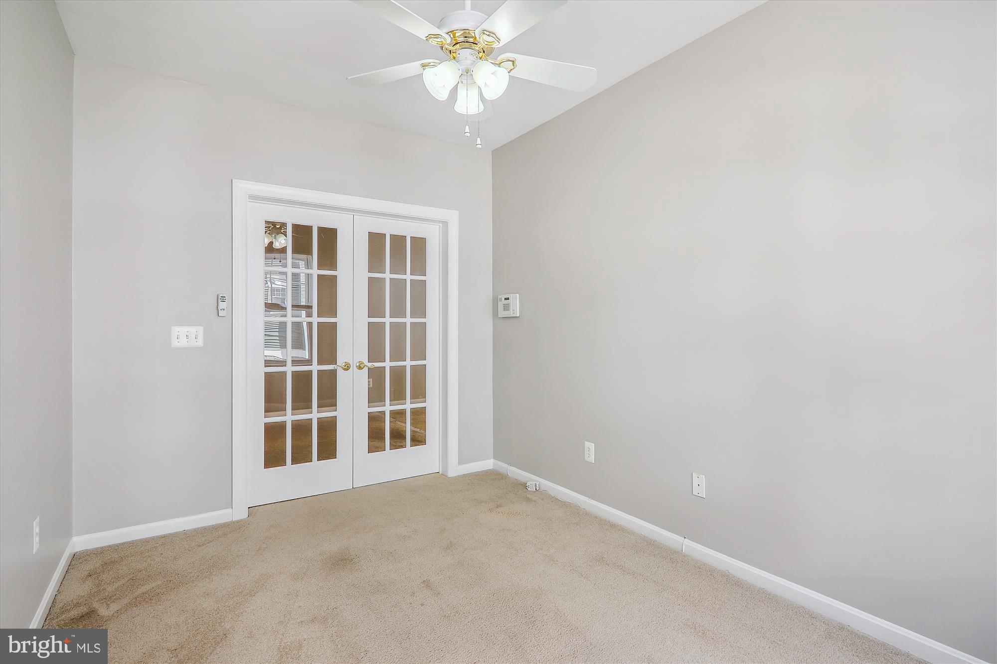 13851 Belle Chasse Boulevard, Unit 213 Laurel, MD 20707 - Photo 13 of 54 a view of an empty room with a window