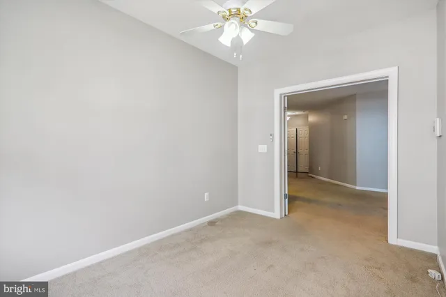 a view of closet area with empty racks