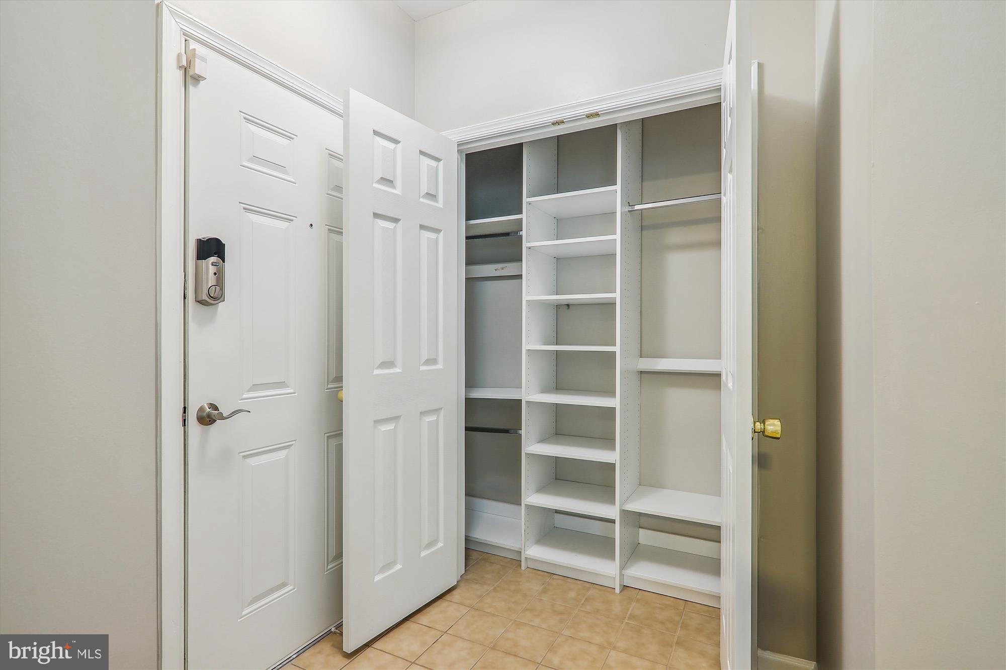 13851 Belle Chasse Boulevard, Unit 213 Laurel, MD 20707 - Photo 17 of 54 a view of closet area with empty racks