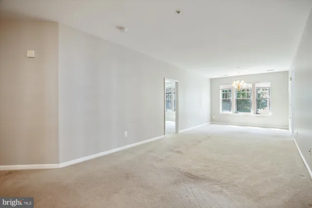 a view of a room with a ceiling fan