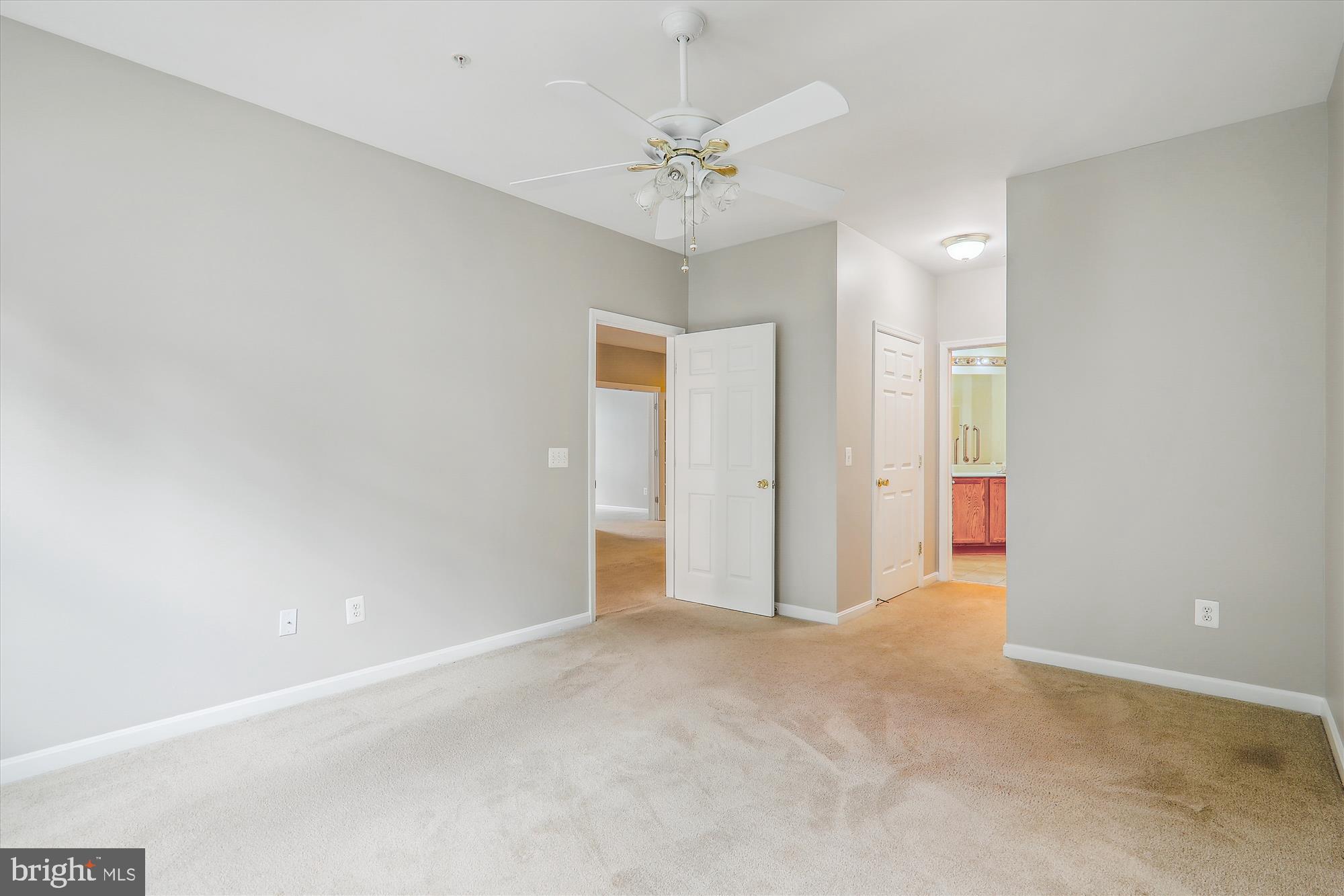 13851 Belle Chasse Boulevard, Unit 213 Laurel, MD 20707 - Photo 22 of 54 a view of a room with a ceiling fan