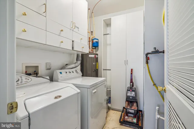 a bathroom with a sink toilet vanity tub and shower
