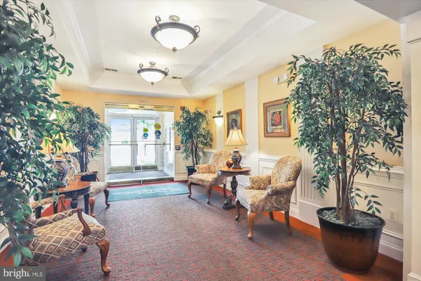 a view of a livingroom with dining room and furniture