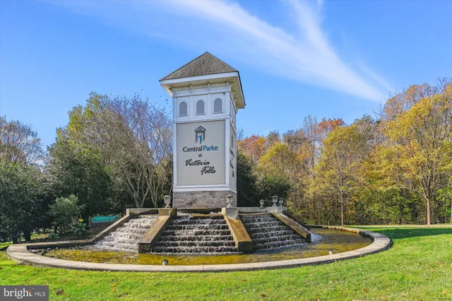 a front view of a house with a big yard