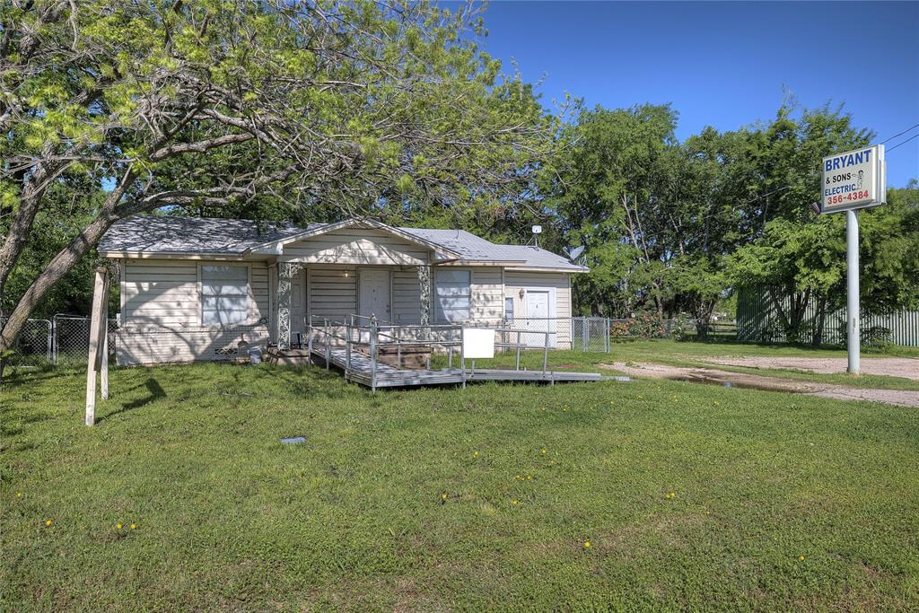 8782 Highway 34 Quinlan, TX 75474 - Photo 17 of 37 a front view of a house with a garden