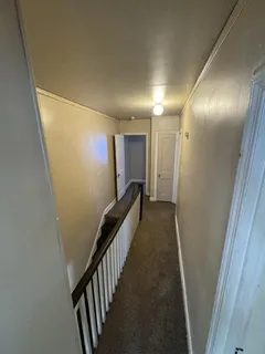 a view of hallway with stairs