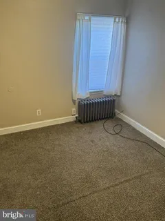 a view of a room with wooden door