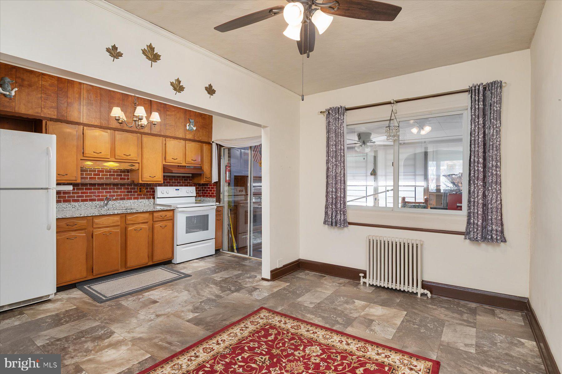 179 West Meadow Road Baltimore, MD 21225 - Photo 12 of 34 a open kitchen with stainless steel appliances granite countertop a refrigerator and a stove top oven