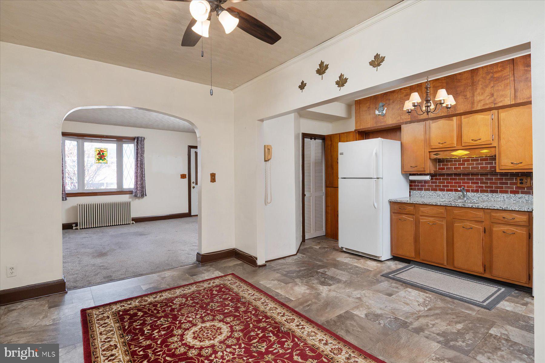 179 West Meadow Road Baltimore, MD 21225 - Photo 13 of 34 a view of a kitchen with a sink and a refrigerator