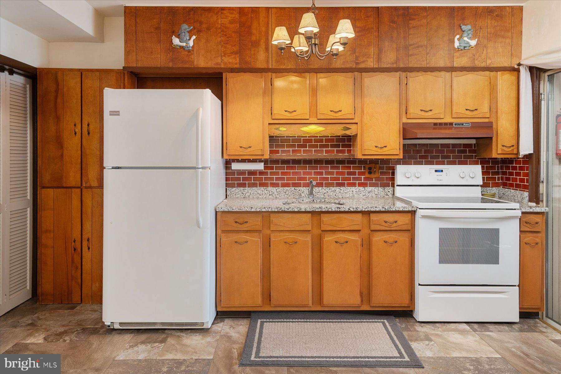 179 West Meadow Road Baltimore, MD 21225 - Photo 14 of 34 a kitchen with stainless steel appliances granite countertop a refrigerator and a stove