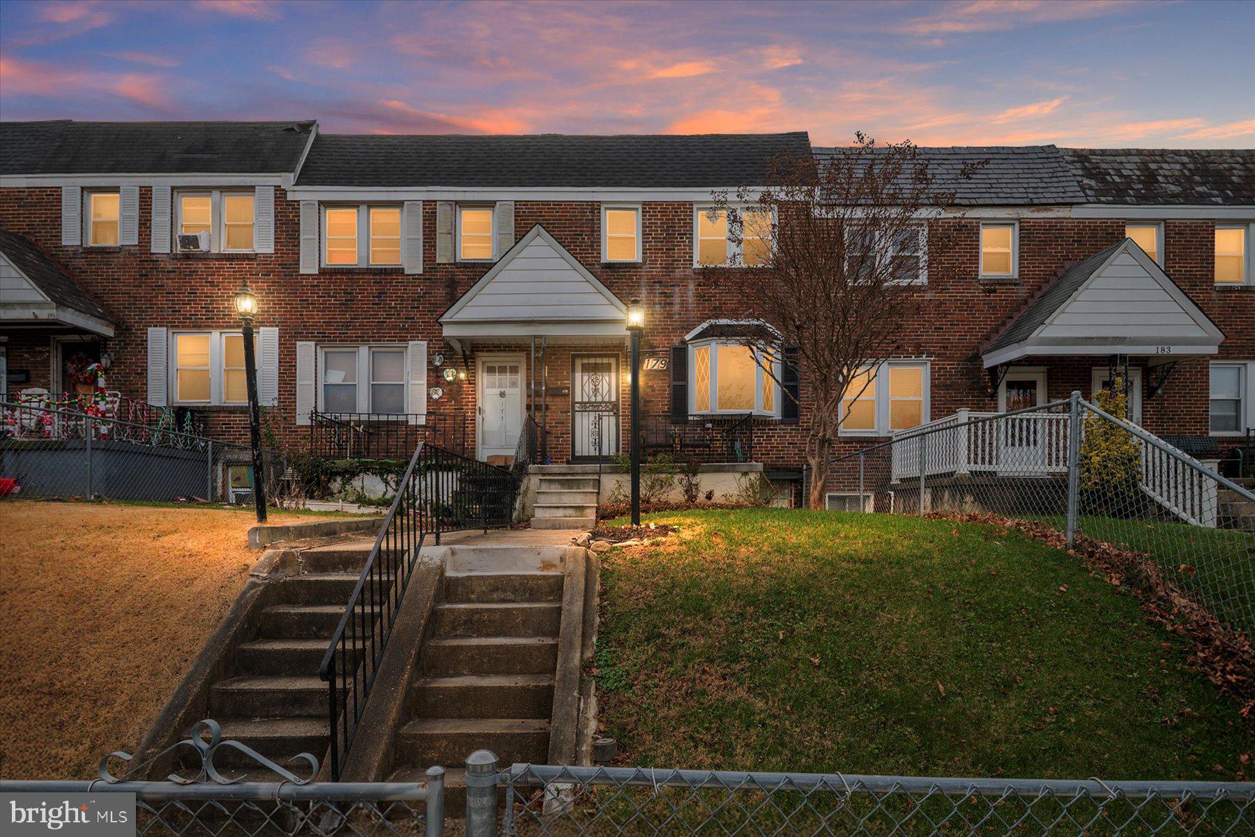 179 West Meadow Road Baltimore, MD 21225 - Photo 2 of 34 a front view of a house with yard